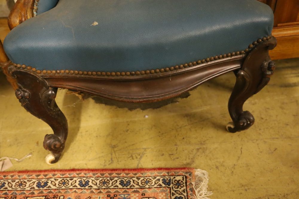 A Victorian mahogany spoonback armchair